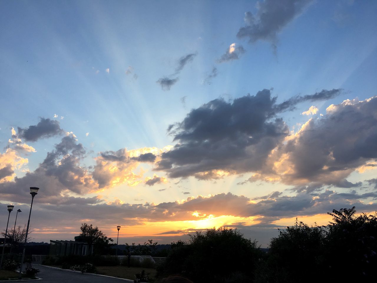 sunset, sky, cloud - sky, tree, silhouette, no people, scenics, beauty in nature, nature, built structure, outdoors, building exterior, city, architecture, day