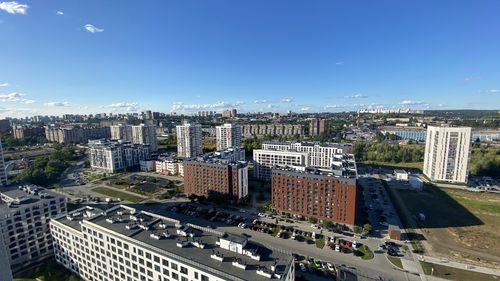 High angle view of buildings in city against sky