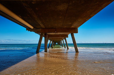 Pier over sea against sky