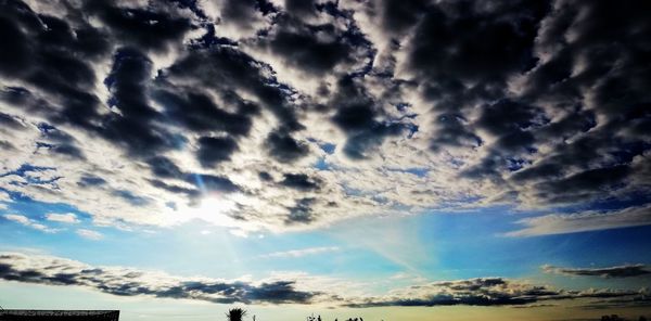 Low angle view of clouds in sky during sunset