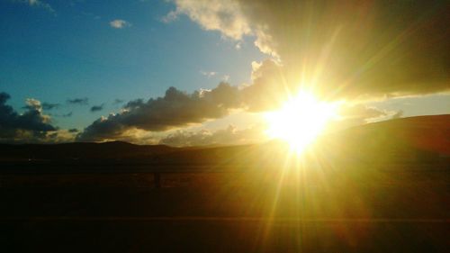 Scenic view of landscape at sunset