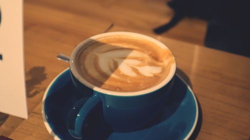 High angle view of coffee cup on table