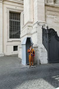 Man statue outside historic building