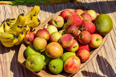 Close-up of apples in basket on table