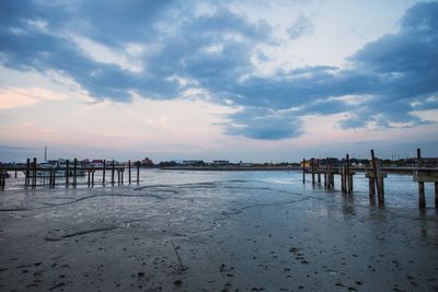 Scenic view of beach against sky during sunset