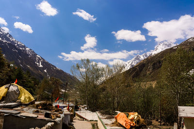 People on mountain road against sky