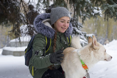 Girl with dog outdoors