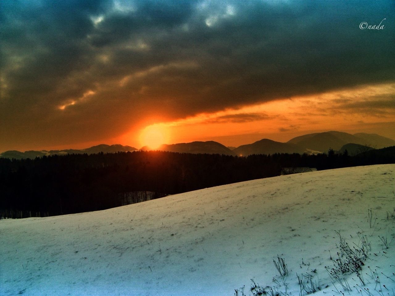 snow, winter, cold temperature, sunset, tranquil scene, scenics, season, tranquility, beauty in nature, landscape, weather, sky, sun, covering, orange color, nature, cloud - sky, mountain, idyllic, frozen