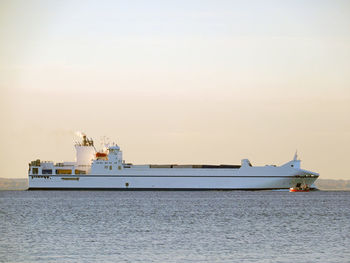 Boats in sea against sky