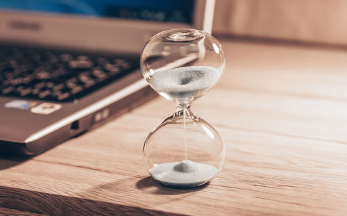 Close-up of clock on table