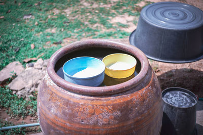 High angle view of metal container on field