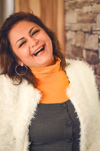 Portrait of a smiling young woman outdoors