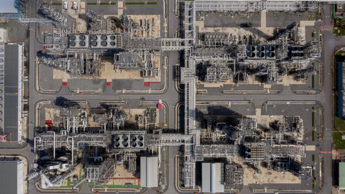 Aerial top view oil and gas refinery petrochemical plant industrial with oil and gas storage tank.