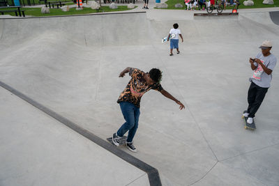 Full length of people on skateboard