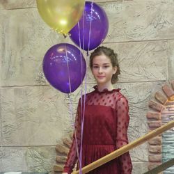 Portrait of a beautiful young woman with balloons