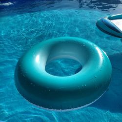 High angle view of blue inflatable ring floating on swimming pool