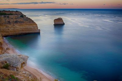 Scenic view of praia da marinha beach during sunset