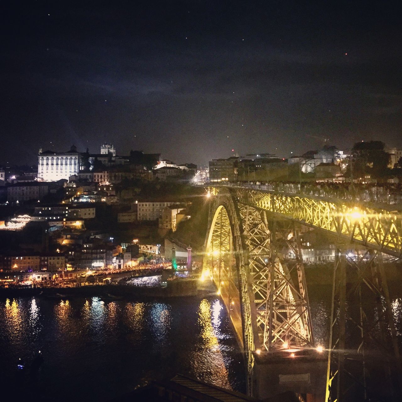 ILLUMINATED BUILDINGS IN CITY AT NIGHT