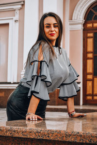 Portrait of woman standing outdoors