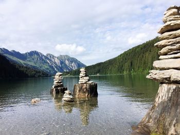 Scenic view of lake and mountains against sky