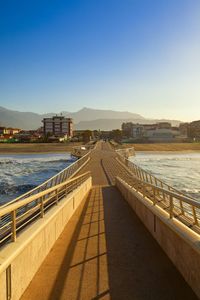 View of bridge over river against clear sky