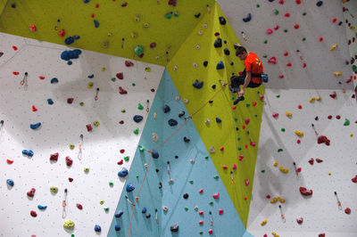 Man climbing on wall