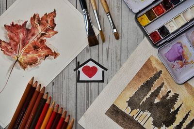 High angle view of autumn leaves on table