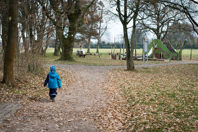 Boy walking in park
