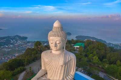Statue of buddha against sky