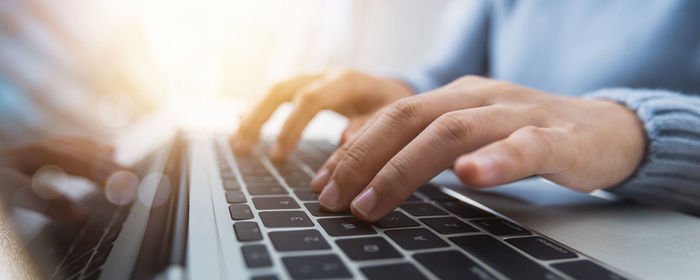 Close-up of man using mobile phone