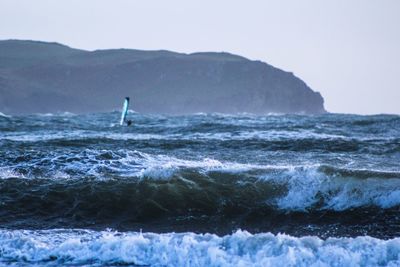 Windsurfer against sky