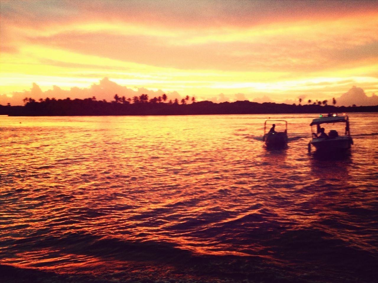 sunset, water, sky, sea, nautical vessel, orange color, transportation, scenics, waterfront, mode of transport, boat, cloud - sky, beauty in nature, silhouette, tranquil scene, nature, tranquility, leisure activity, lifestyles