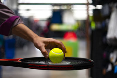 Close-up of hand holding ball