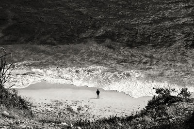 High angle view of person standing at beach