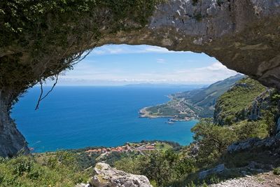 A huge natural arch in the rock on top of the mountain in spain