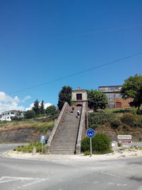 View of road against clear blue sky