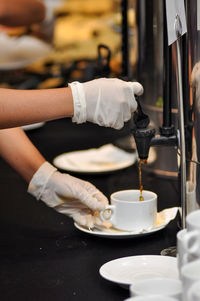 Cropped hand of man washing hands