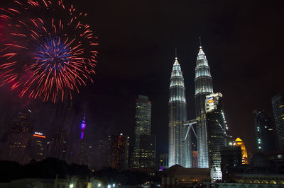 Low angle view of illuminated city at night