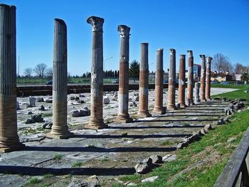 View of columns in row against blue sky