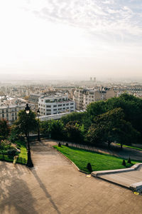 High angle view of trees and buildings against sky