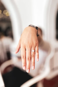 Cropped hand of woman holding hands