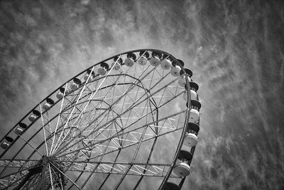 Low angle view of ferris wheel against sky