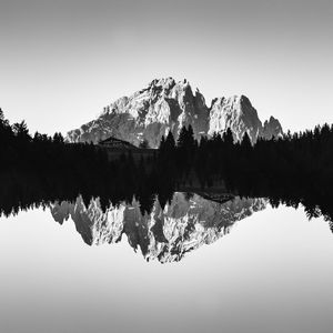 Reflection of trees in lake against sky