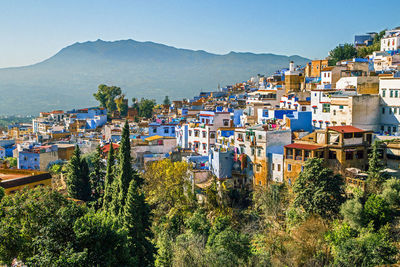 Panoramic wide angle view of iconic blue city, kasbah and medina , chefchaouen. morocco, africa