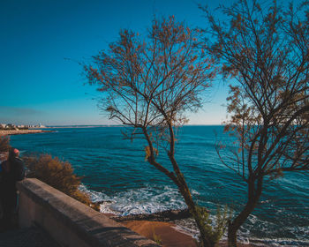 Scenic view of sea against clear blue sky