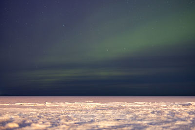 Scenic view of sea against sky at night