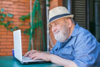 Portrait of man using mobile phone