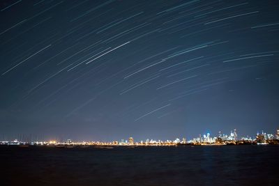 Scenic view of illuminated city against sky at night