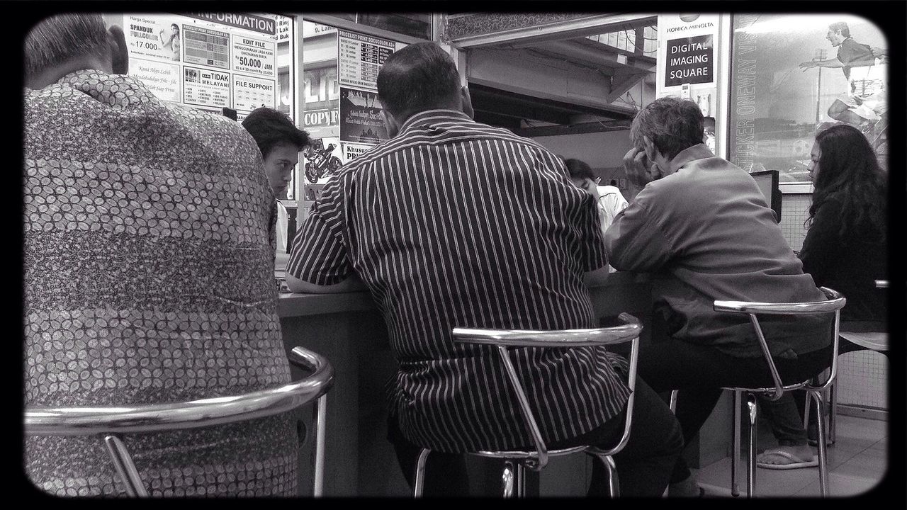 transfer print, chair, sitting, auto post production filter, seat, relaxation, men, indoors, empty, table, rear view, sidewalk cafe, absence, person, side by side, day, restaurant, lifestyles, in a row