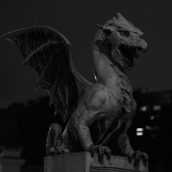 Statue of angel at night